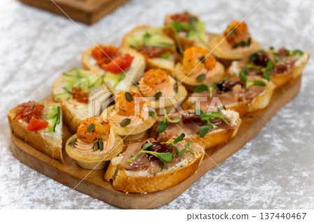 Bruschetta with prosciutto, cream cheese and herb topping Bruschetta with prosciutto, cream cheese and herb topping 137440467