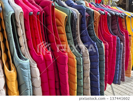 Multicolored bologna vests displayed for sale on a busy street market in the afternoon 137441602