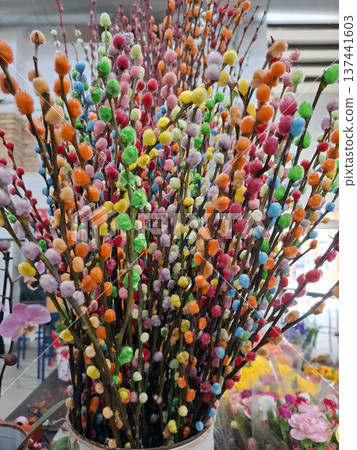 Colorful painted pussy willow branches in a flower shop during spring for the Easter celebration season 137441603