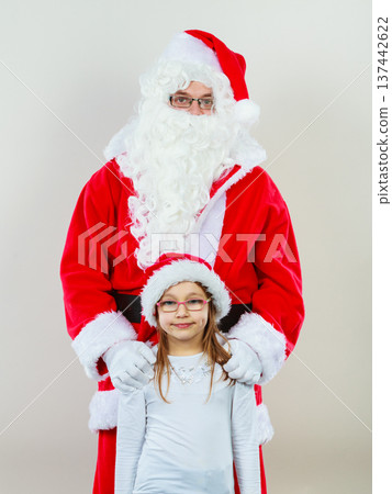 Christmas Santa Claus with girl in hat Christmas Santa Claus with girl in hat 137442622