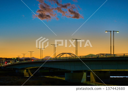 A view of Tamagawahara Bridge, Inagi City, and Mount Fuji from Chofu City, Tokyo, on an autumn evening A view of Tamagawahara Bridge, Inagi City, and Mount Fuji from Chofu City, Tokyo, on an autumn evening 137442680