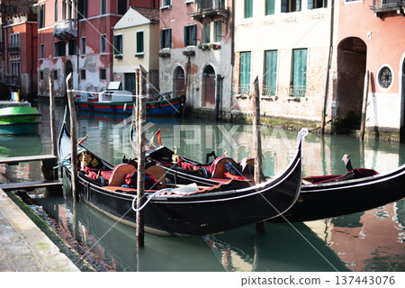 Canal with two gondolas in Venice, Italy. Architecture and landmarks of Venice. Venice postcard with Venice gondolas Canal with two gondolas in Venice, Italy. Architecture and landmarks of Venice. Venice postcard with Venice gondolas 137443076