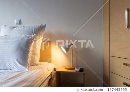 bedroom interior with bedside lamp wooden furniture bedroom interior with bedside lamp wooden furniture 137443565