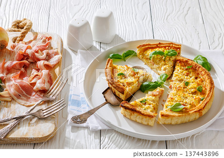 Quiche Lorraine on a white plate, top view 137443896