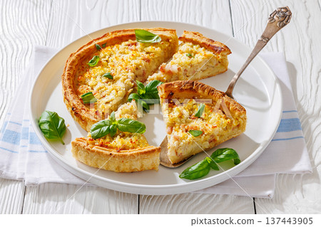 Quiche Lorraine on a white plate, top view 137443905