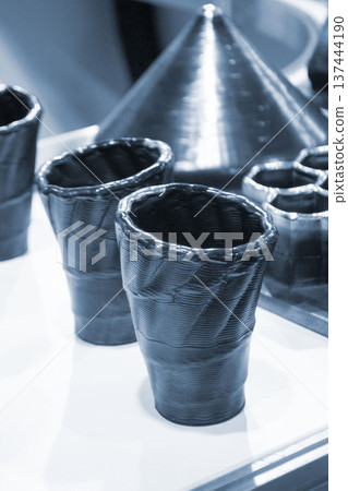 Model printed on 3D printer from metal. Object created on 3D printer from melting metal thread. Modern new technologies. Additive progressive manufacturing solution. Metal 3d printing technology Model printed on 3D printer from metal. Object created on 3D printer from melting metal thread. Modern new technologies. Additive progressive manufacturing solution. Metal 3d printing technology 137444190