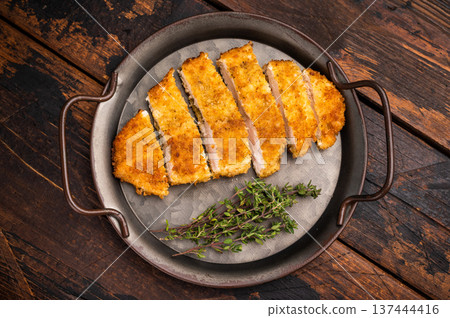 Katsu Golden fried cutlet. This Japanese favorite brings comfort and flavor to any table. wooden background. top view Katsu Golden fried cutlet. This Japanese favorite brings comfort and flavor to any table. wooden background. top view 137444416