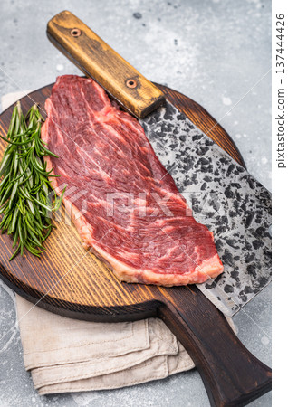 Raw top sirloin cut or rump steak, fresh beef meat. grey background. top view Raw top sirloin cut or rump steak, fresh beef meat. grey background. top view 137444426