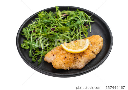 Pan fried red perch fish fillet served with fresh arugula salad and lemon on isolated background. 137444467