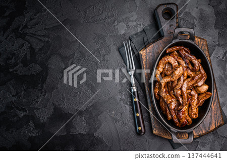 Korean Beef Meat Bulgogi Hot Plate. black background. top view 137444641