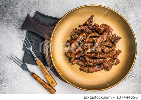Asian food Teriyaki beef meat on a plate on grey background. top view 137444650