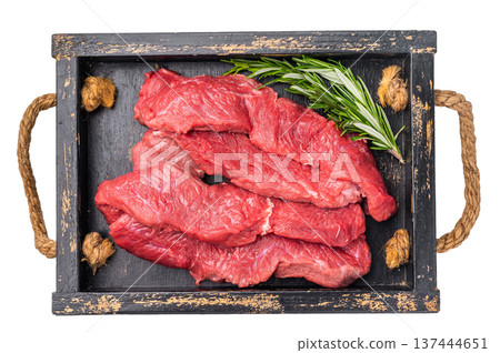 Vibrant raw bison meat pieces on a butcher block, illustrating the allure of this lean protein source for health-conscious culinary enthusiasts. isolated on white background. top view 137444651