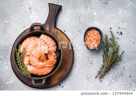 Raw Headless Red Argentine shrimps, Prawns in a skillet. grey background. top view 137444844