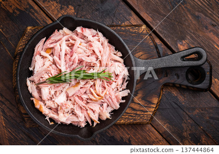 BBQ smoked Pulled Chicken meat in a skillet. wooden background. top view BBQ smoked Pulled Chicken meat in a skillet. wooden background. top view 137444864