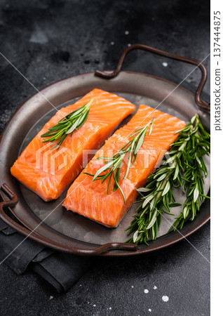 Raw Salmon fillet steak with rosemary ready for cooking. black background. top view 137444875