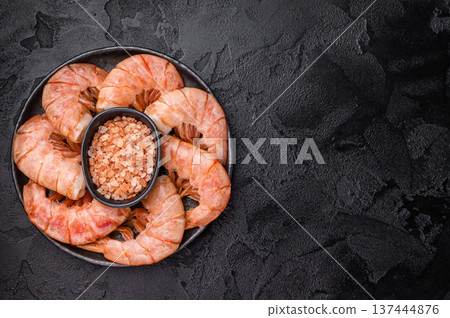 Plate with Headless Red Argentine shrimps, Prawns. black background. top view Plate with Headless Red Argentine shrimps, Prawns. black background. top view 137444876