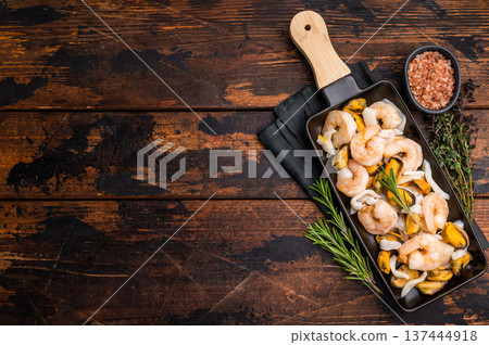 Seafood Cocktail appetiser with Mussels, Clams, Prawns, Shrimps and squid. wooden background. top view Seafood Cocktail appetiser with Mussels, Clams, Prawns, Shrimps and squid. wooden background. top view 137444918