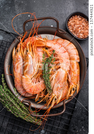 Red Argentine shrimps, raw Prawns Langostino Austral in steel tray. black background. top view Red Argentine shrimps, raw Prawns Langostino Austral in steel tray. black background. top view 137444921