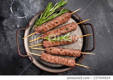 Grilled minced beef and lamb kebabs skewers with fresh spices, arabic kofta kofte kebab. black background. top view 137444924