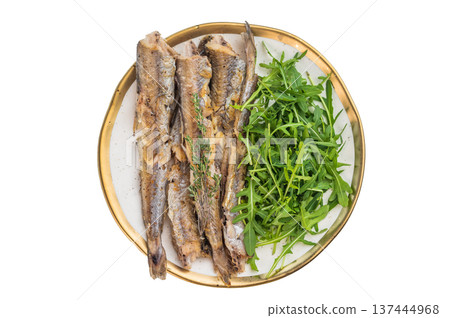 Golden baked blue whiting fish with fresh greens on elegant plate, healthy marine cuisine idea with airy copy space and clean styling 137444968
