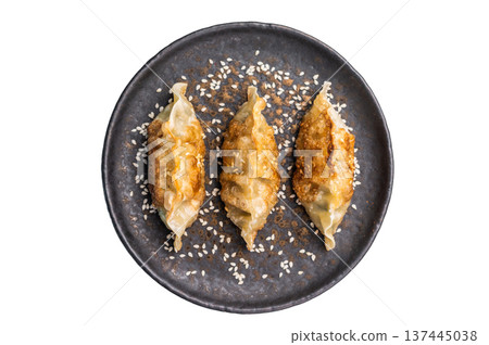 Fried Chinese Dumplings Jiaozi with shrimps and vegetables on plate isolated on white background. top view Fried Chinese Dumplings Jiaozi with shrimps and vegetables on plate isolated on white background. top view 137445038