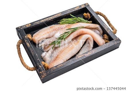 Ready for cooking Raw Hake fish fillets in a wooden tray with herbs isolated on white background. top view 137445044