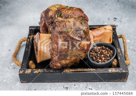 Juicy beef shank ossobuco slow cooked with marrow bone thyme top view copy space 137445084