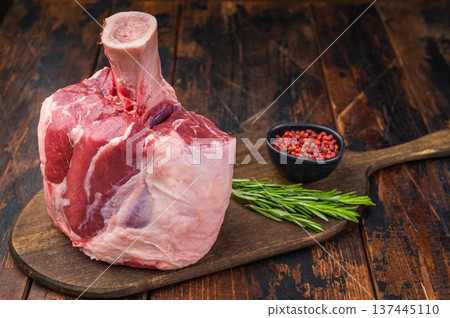 Uncooked beef shank knuckle joint with bone on rustic cutting board ingredient for braising and ossobuco 137445110