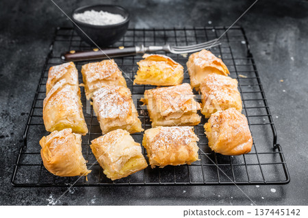 Milk pie custard pastry made of crispy filo layers sliced and served as bakery dessert with copy space Milk pie custard pastry made of crispy filo layers sliced and served as bakery dessert with copy space 137445142