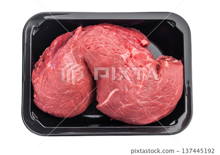 Raw beef cut tenderloin in plastic tray on white background. Fresh meat suitable for steaks or classic homemade roast beef cooking. 137445192