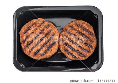 Grilled plant based burger patties vegan meat alternative packaged in black tray isolated on white background top view 137445244