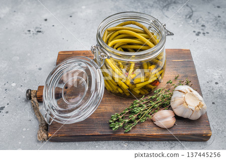 Pickled ramsons in glass jar on wooden board rustic background wild garlic preserve fermented spring greens 137445256