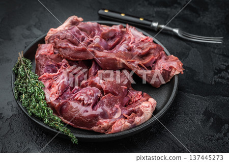 Raw veal hearts prepared for cooking highlighting tender texture great for slow braising frying and gourmet broths. 137445273