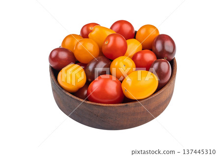 Colorful mix of heirloom cherry tomatoes in a wooden bowl shot overhead on white background, showcasing vibrant fresh produce.. Colorful mix of heirloom cherry tomatoes in a wooden bowl shot overhead on white background, showcasing vibrant fresh produce.. 137445310