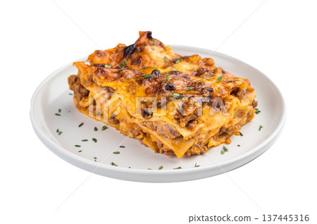 Italian lasagne al forno with minced beef cheese and pasta layers baked until golden close up on white plate Italian lasagne al forno with minced beef cheese and pasta layers baked until golden close up on white plate 137445316