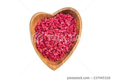 Freeze dried raspberry granules in wooden bowl isolated on white background. Natural vibrant berry texture flatlay 137445320