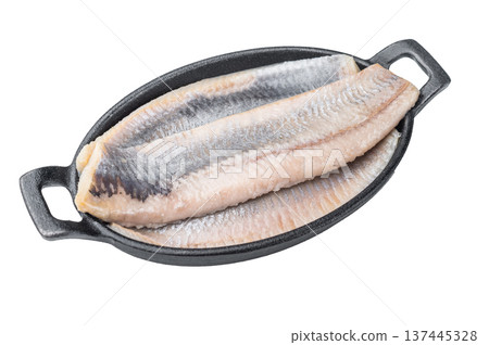 Pickled herring fillets cured in salt and brine arranged in iron pan. Minimal white background traditional seafood ingredient. 137445328