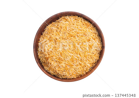 Raw kataifi pastry strands used for kunafa and Middle Eastern desserts. Thin shredded phyllo texture top view Raw kataifi pastry strands used for kunafa and Middle Eastern desserts. Thin shredded phyllo texture top view 137445348
