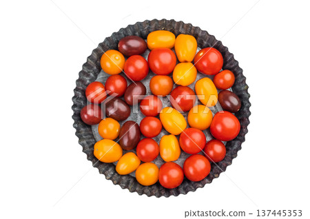 Bright mix of grape and plum cherry tomatoes arranged in a bowl with vivid colors and smooth texture on a minimal backdrop. Bright mix of grape and plum cherry tomatoes arranged in a bowl with vivid colors and smooth texture on a minimal backdrop. 137445353