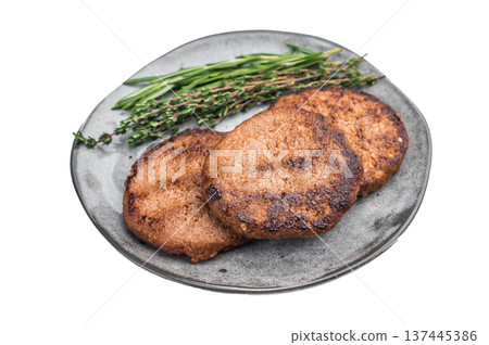 Cooked plant based burger patties served with fresh rosemary and thyme on plate isolated on white background top view 137445386