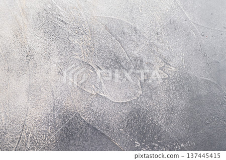 Rough cement surface with natural strokes ideal for culinary mockups and stylish tabletop food photo backgrounds. 137445415