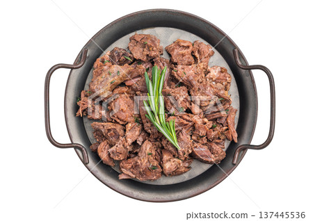 Slowcooked deer and moose meat ragout on textured grey stone backdrop, savory shredded wild game seasoned with herbs. 137445536