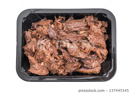 Stewed venison elk meat in a black container on white background, tender braised wild game ready meal rich in flavor and protein. 137445545
