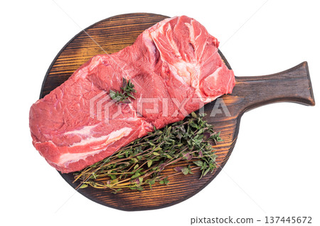 Vibrant raw horse meat on a rustic wooden surface, highlighting its rich color and fine marbling, ideal for unique culinary dishes. isolated on white background. top view Vibrant raw horse meat on a rustic wooden surface, highlighting its rich color and fine marbling, ideal for unique culinary dishes. isolated on white background. top view 137445672