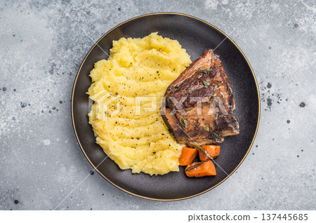 Slow cooked Beef short ribs, perfectly cooked and glazed with a rich barbecue sauce. grey background. top view 137445685