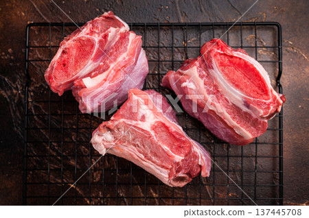Thick Cut raw Beef Short Ribs, fresh meat with bone. brown background. top view Thick Cut raw Beef Short Ribs, fresh meat with bone. brown background. top view 137445708