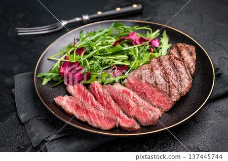 Succulent Denver cut, showcasing a perfect sear and rich color after grilling. black background. top view Succulent Denver cut, showcasing a perfect sear and rich color after grilling. black background. top view 137445744