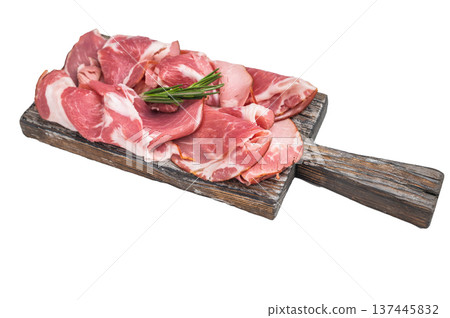 Cured Italian capocollo ham arranged on an aged wooden board with fresh rosemary sprigs on white surface ideal for culinary stock. 137445832
