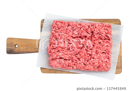 Uncooked minced meat slab on rustic board and white surface highlighting raw texture ideal for culinary, butcher and food prep visuals. Uncooked minced meat slab on rustic board and white surface highlighting raw texture ideal for culinary, butcher and food prep visuals. 137445849