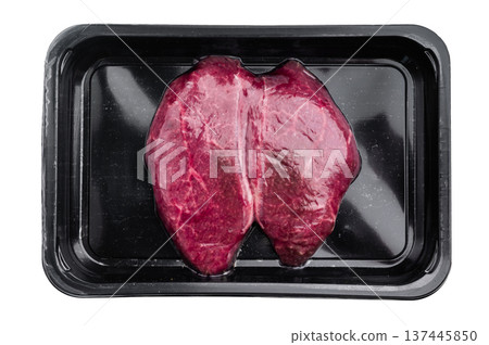 Raw Wagyu chuck steak with rich marbling packaged in a black tray on white background perfect for premium butcher and gourmet food stock images. 137445850